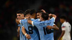 Uruguay�s players celebrate after US' defender Joshua Wynder scored an own gol during the Argentina 2023 U-20 World Cup quarter-final football match between United States and Uruguay at the Madre de Ciudades stadium in Santiago del Estero, Argentina, on June 4, 2023. (Photo by Luis ROBAYO / AFP)