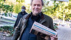 Steve Bannon, former advisor to President Donald Trump, brandishes a Financial Times headline about Liz Truss, upon arriving for sentencing.