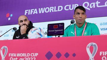 Morocco's coach Walid Regragui and Morocco's goalkeeper Ahmed Tagnaouti attend a press conference at the Qatar National Convention Center (QNCC) in Doha on December 9, 2022, on the eve of the Qatar 2022 World Cup quarter-final football match between Morocco and Portugal. (Photo by KARIM JAAFAR / AFP)