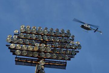 Serbian police helicopter flies over the stadium ahead of the Serbian National soccer league derby match between Partizan and Red Star, in Belgrade on February 27, 2016. Red Star won 1-2 at the 150th edition of the 'Eternal Derby'. / AFP / ANDREJ ISAKOVIC