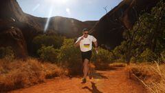 AYERS ROCK, AUSTRALIA - 16 JUNE 2018: (EDITORS NOTE: A polarizing filter was used for this image.) Australian olympic bobsledder Lachlan Reidy competes in the Uluru Relay Run as part of the National Deadly Fun Run Championships on June 16, 2018 in Uluru, 