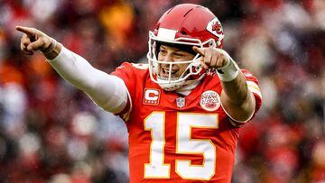 KANSAS CITY, MO - JANUARY 12: Patrick Mahomes #15 of the Kansas City Chiefs points to the sidelines in celebration after throwing a touchdown against the Kansas City Chiefs during the first quarter of the AFC Divisional Round playoff game at Arrowhead Sta