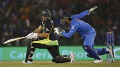 India&#039;s captain and wicketkeeper Mahendra Singh Dhoni runs to field the ball off the bat of Australia&#039;s Aaron Finch.