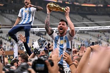 Lionel Messi wore a special version of the Argentina shirt immediately after the game with 3 stars, the World Cup winners' patch and a special celebratory message on the back. (Photo by Kirill KUDRYAVTSEV / AFP)