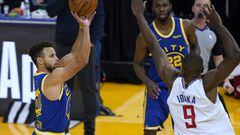 Golden State Warriors guard Stephen Curry (30) takes a three-point shot over Los Angeles Clippers forward Serge Ibaka (9) during the second half of an NBA basketball game in San Francisco, Friday, Jan. 8, 2021. (AP Photo/Tony Avelar)
