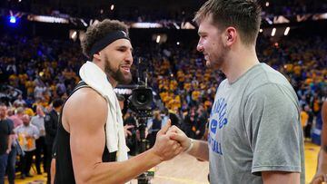 Dallas Mavericks guard Luka Doncic with Golden State Warriors guard Klay Thompson after game five of the 2022 western conference finals at Chase Center.
