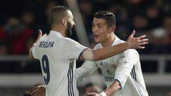 Real Madrid forward Cristiano Ronaldo celebrates scoring a goal with Karim Benzema.