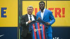 BARCELONA, SPAIN - JULY 6: FC Barcelona's new Ivorian midfielder Franck Kessie (R) poses with Barcelona's President Joan Laporta during his presentation ceremony at the Joan Gamper training ground in Sant Joan Despi, near Barcelona on July 6, 2022. (Photo by Adria Puig/Anadolu Agency via Getty Images)