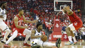 Donovan Mitchell #45 of the Utah Jazz looks to pass defended by Eric Gordon #10 of the Houston Rockets and PJ Tucker #17 in the first half during Game Five of the first round of the 2019 NBA Western Conference Playoffs between the Houston Rockets and the Utah Jazz at Toyota Center on April 24, 2019 in Houston, Texas.
