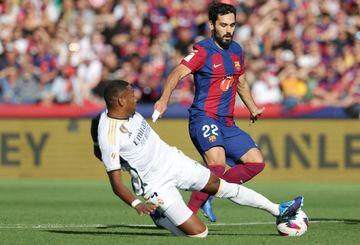 Ilkay Gundogan is tackled by Real Madrid's David Alaba during El Clásico on Saturday.