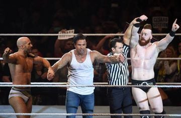 Wiese (second left) and his fight partners Cecaro (left) and Sheamus (right) react after winning the WWE (World Wrestling Entertainment) Six-Man-Tag-Team-Match in Munich.
