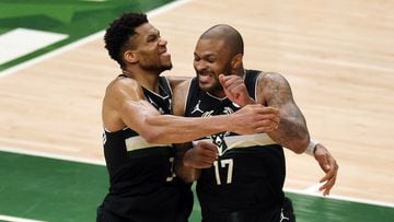 MILWAUKEE, WISCONSIN - JULY 20: Giannis Antetokounmpo #34 of the Milwaukee Bucks celebrates with teammate P.J. Tucker #17 in the final seconds before defeating the Phoenix Suns in Game Six to win the 2021 NBA Finals at Fiserv Forum on July 20, 2021 in Mil