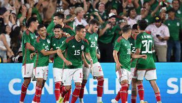 Mexico players celebrate teammate Hirving Lozano's goal (not in picture) during the international friendly football match between Mexico and Peru at the Rose Bowl in Pasadena, California, on September 24, 2022. (Photo by Robyn Beck / AFP)