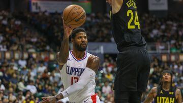 HONOLULU, HAWAII - OCTOBER 8: Paul George #13 of the Los Angeles Clippers passes the ball against Walker Kessler #24 of the Utah Jazz during the first half of the preseason game at SimpliFi Arena at the Stan Sheriff Center on October 8, 2023 in Honolulu, Hawaii. NOTE TO USER: User expressly acknowledges and agrees that, by downloading and or using this photograph, User is consenting to the terms and conditions of the Getty Images License Agreement.   Darryl Oumi/Getty Images/AFP (Photo by Darryl Oumi / GETTY IMAGES NORTH AMERICA / Getty Images via AFP)