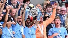 Manchester City's German midfielder Ilkay Gundogan (C) lifts the trophy after the English FA Cup final football match between Manchester City and Manchester United at Wembley stadium, in London, on June 3, 2023. Man City won the game 2-1. (Photo by Glyn KIRK / AFP) / NOT FOR MARKETING OR ADVERTISING USE / RESTRICTED TO EDITORIAL USE