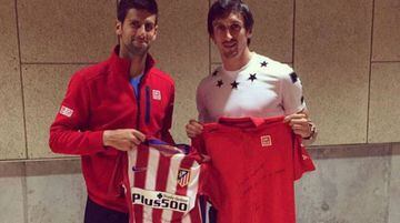 Djokovic (left) and Savic swap shirts at the Madrid Open.