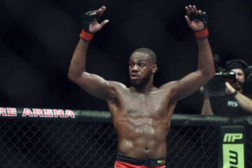 Jon Jones puts his arms in the air after the UFC light heavy weight championship fight against Glover Texeira.