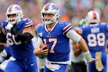 EAST RUTHERFORD, NEW JERSEY - NOVEMBER 06: Josh Allen #17 of the Buffalo Bills rushes for a touchdown against the New York Jets during the second quarter at MetLife Stadium on November 06, 2022 in East Rutherford, New Jersey.   Mike Stobe/Getty Images/AFP