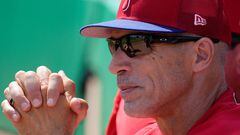 (FILES) In this file photo taken on March 19, 2022, Manager Joe Girardi of the Philadelphia Phillies watches a pregame ceremony prior to the Spring Training game against the Toronto Blue Jays in Clearwater, Florida. - The Philadelphia Phillies sacked manager Joe Girardi on June 3, 2022,, citing the team's sluggish start to the season. Phillies president of baseball operations Dave Dombrowski said in a statement the team had decided to part company with Girardi after a "frustrating" campaign. (Photo by Mark Brown / GETTY IMAGES NORTH AMERICA / AFP)