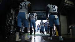 EAST RUTHERFORD, NEW JERSEY - DECEMBER 16: Josh Kline #64 and Marcus Mariota #8 of the Tennessee Titans join their team entering the field against the New York Giants during their game at MetLife Stadium on December 16, 2018 in East Rutherford, New Jersey
