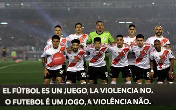 Players of River Plate pose for pictures before the start of the all-Argentine Copa Libertadores semi-final first leg football match against Boca Juniors at the Monumental stadium in Buenos Aires, on October 1, 2019. - The banner reads "Football is a Game