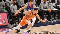 DENVER, CO - JUNE 11: Devin Booker #1 of the Phoenix Suns drives towards the hoop against Michael Porter Jr. #1 of the Denver Nuggets in Game Three of the Western Conference second-round playoff series at Ball Arena on June 11, 2021 in Denver, Colorado. N