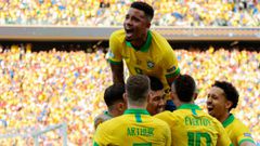 Brazil&#039;s Roberto Firmino celebrates with teammates after scoring the team&#039;s second goal against Peru during their Copa America football tournament group match at the Corinthians Arena in Sao Paulo, Brazil, on June 22, 2019. (Photo by Miguel SCHI