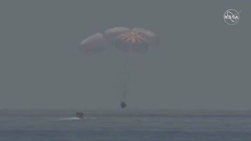 A capsule with NASA astronauts Robert Behnken and Douglas Hurley splashes down in the Gulf of Mexico, August 2, 2020, in this screen grab taken from a video. NASA/Handout via REUTERS   ATTENTION EDITORS - THIS IMAGE HAS BEEN SUPPLIED BY A THIRD PARTY.
