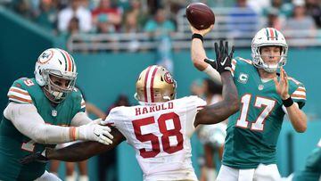 Nov 27, 2016; Miami Gardens, FL, USA; Miami Dolphins quarterback Ryan Tannehill (17) throws a pass over San Francisco 49ers outside linebacker Eli Harold (58) during the second half at Hard Rock Stadium. The Dolphins won 31-24. Mandatory Credit: Steve Mitchell-USA TODAY Sports