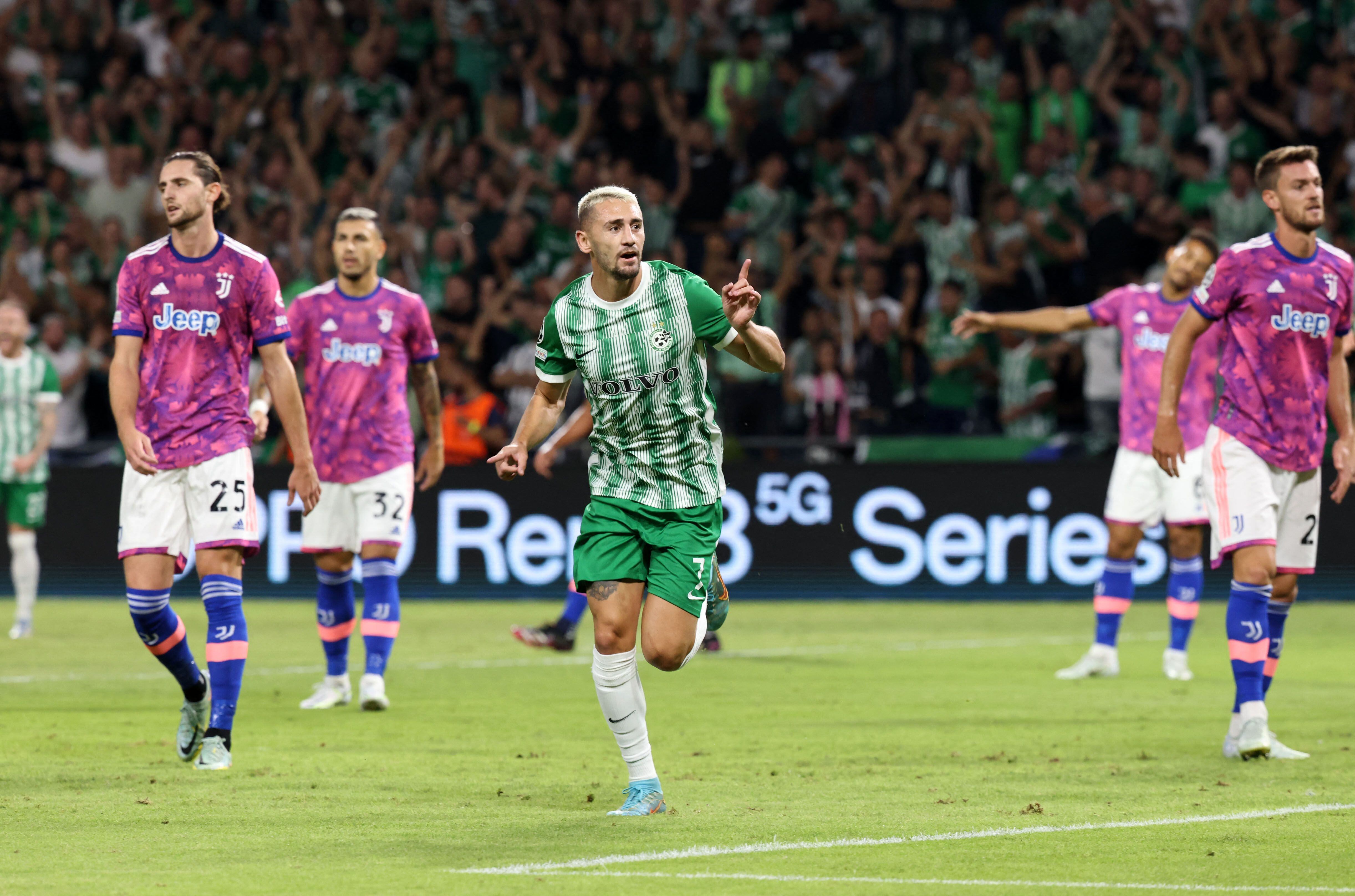Maccabi Haifa's Israeli midfielder Omer Atzili celebrates his goal during the UEFA Champions League group H football match between Israel's Maccabi Haifa and Italy's Juventus at the Sammy Ofer stadium in the city of Haifa on October 11, 2022. (Photo by RONALDO SCHEMIDT / AFP)