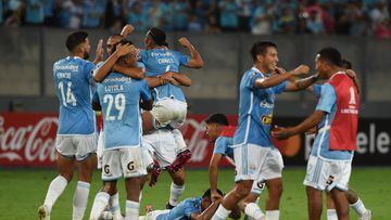 Players of Sporting Cristal celebrate after winning the Copa Libertadores third round second leg football match between Peru's Sporting Cristal and Argentina's Huracan in the last minute, at the National Stadium in Lima, on March 16, 2023. (Photo by CRIS BOURONCLE / AFP)