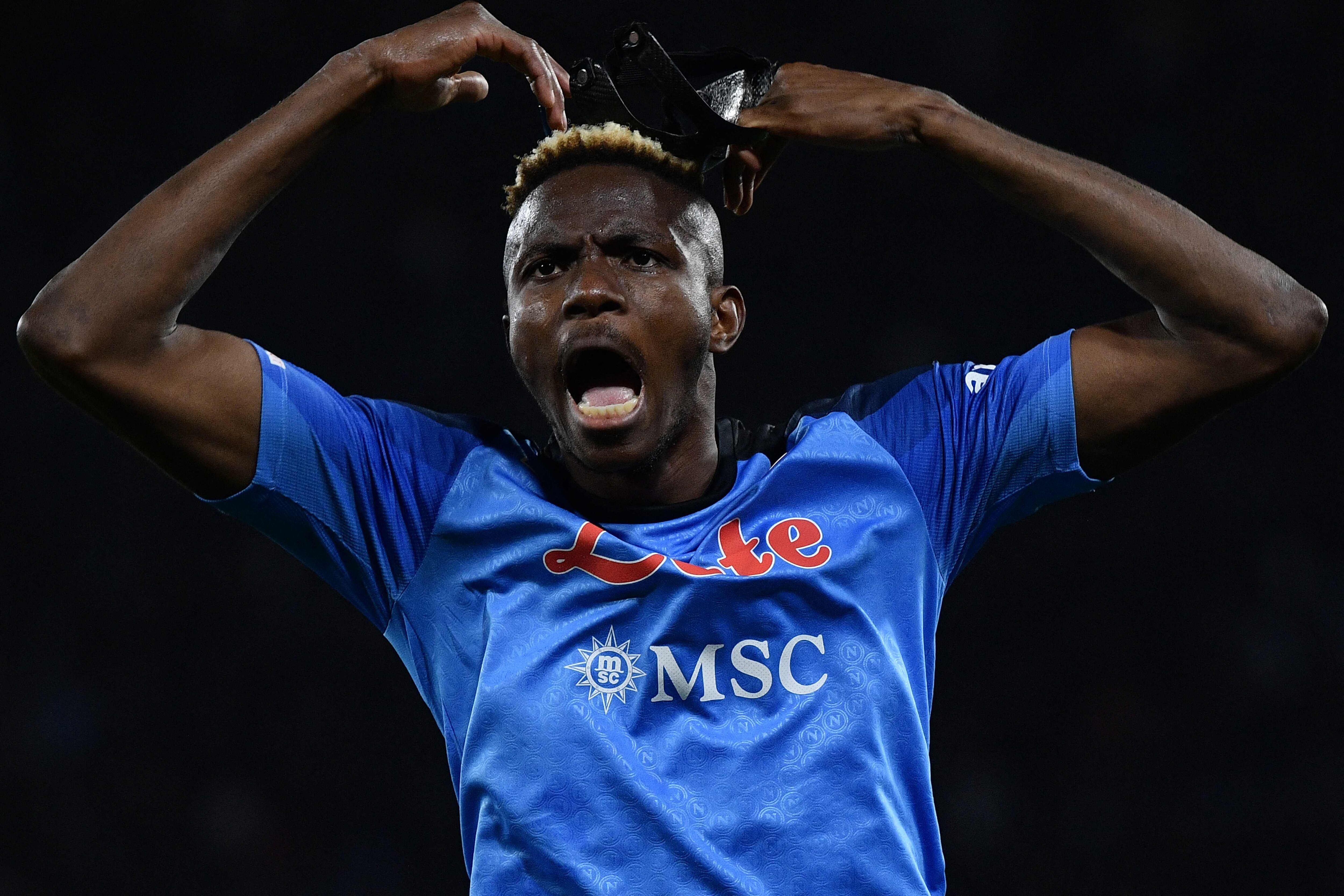 Napoli's Nigerian forward Victor Osimhen celebrates after Napoli opened the scoring during the Italian Serie A football match between Napoli and Atalanta on March 11, 2023 at the Diego-Maradona stadium in Naples. (Photo by Filippo MONTEFORTE / AFP)