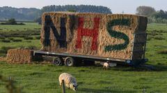 BRAMBER, UNITED KINGDOM  - MAY 07:  NHS is painted onto some hay bales on a farm in Sussex on May 07, 2020 in Bramber, United Kingdom. The UK is continuing with quarantine measures intended to curb the spread of Covid-19, but as the infection rate is fall