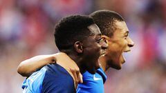 Ousmane Dembele of France celebrates with Kylian Mbappe