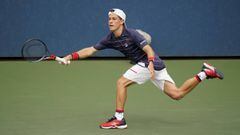 Diego Schwartzman, of Argentina, returns a shot to Cameron Norrie, of Great Britain, during the first round of the US Open tennis championships, Monday, Aug. 31, 2020, in New York. (AP Photo/Frank Franklin II)