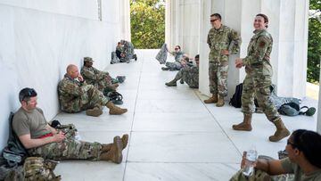 Members of the DC National Guard take a short rest from standing guard at the Lincoln Memorial, in Washington, D.C., U.S., June 4, 2020. Jim Lo Scalzo/Pool via REUTERS