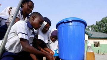 FILE PHOTO: Students of JSS Tudun Wada school wash their hands,  amid the coronavirus disease (COVID-19) outbreak, in Abuja, Nigeria March 19, 2020. REUTERS/Afolabi Sotunde/File Photo