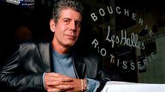 FILE - This Dec. 19, 2001 file photo shows Anthony Bourdain, the owner and chef of Les Halles restaurant, sitting at one of the tables in New York. On Friday, June 8, 2018, Bourdain was found dead in his hotel room in France, while working on his CNN series on culinary traditions around the world. (AP Photo/Jim Cooper,File)