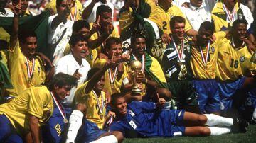 Brazil with the trophy after beating Italy in the final. A young Ronaldo Nazario can be seen at the front.