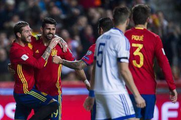 Diego Costa of Spain celebrates with his teammates Sergio Ramos of Spain after scoring his team's third goal