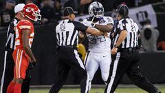 Oct 19, 2017; Oakland, CA, USA; Oakland Raiders running back Marshawn Lynch (24) in an altercation with the referees during the second quarter against the Kansas City Chiefs at Oakland Coliseum. Mandatory Credit: Kelley L Cox-USA TODAY Sports