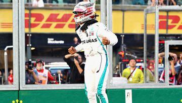 MELBOURNE, AUSTRALIA - MARCH 24:  Lewis Hamilton of Great Britain and Mercedes GP celebrates on track after qualifying in pole position during qualifying for the Australian Formula One Grand Prix at Albert Park on March 24, 2018 in Melbourne, Australia.  