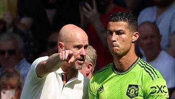 Manchester United's Dutch manager Erik ten Hag (L) directs substitute Manchester United's Portuguese striker Cristiano Ronaldo during the English Premier League football match between Southampton and Manchester United at St Mary's Stadium in Southampton, southern England on August 27, 2022. (Photo by Adrian DENNIS / AFP) / RESTRICTED TO EDITORIAL USE. No use with unauthorized audio, video, data, fixture lists, club/league logos or 'live' services. Online in-match use limited to 120 images. An additional 40 images may be used in extra time. No video emulation. Social media in-match use limited to 120 images. An additional 40 images may be used in extra time. No use in betting publications, games or single club/league/player publications. / 