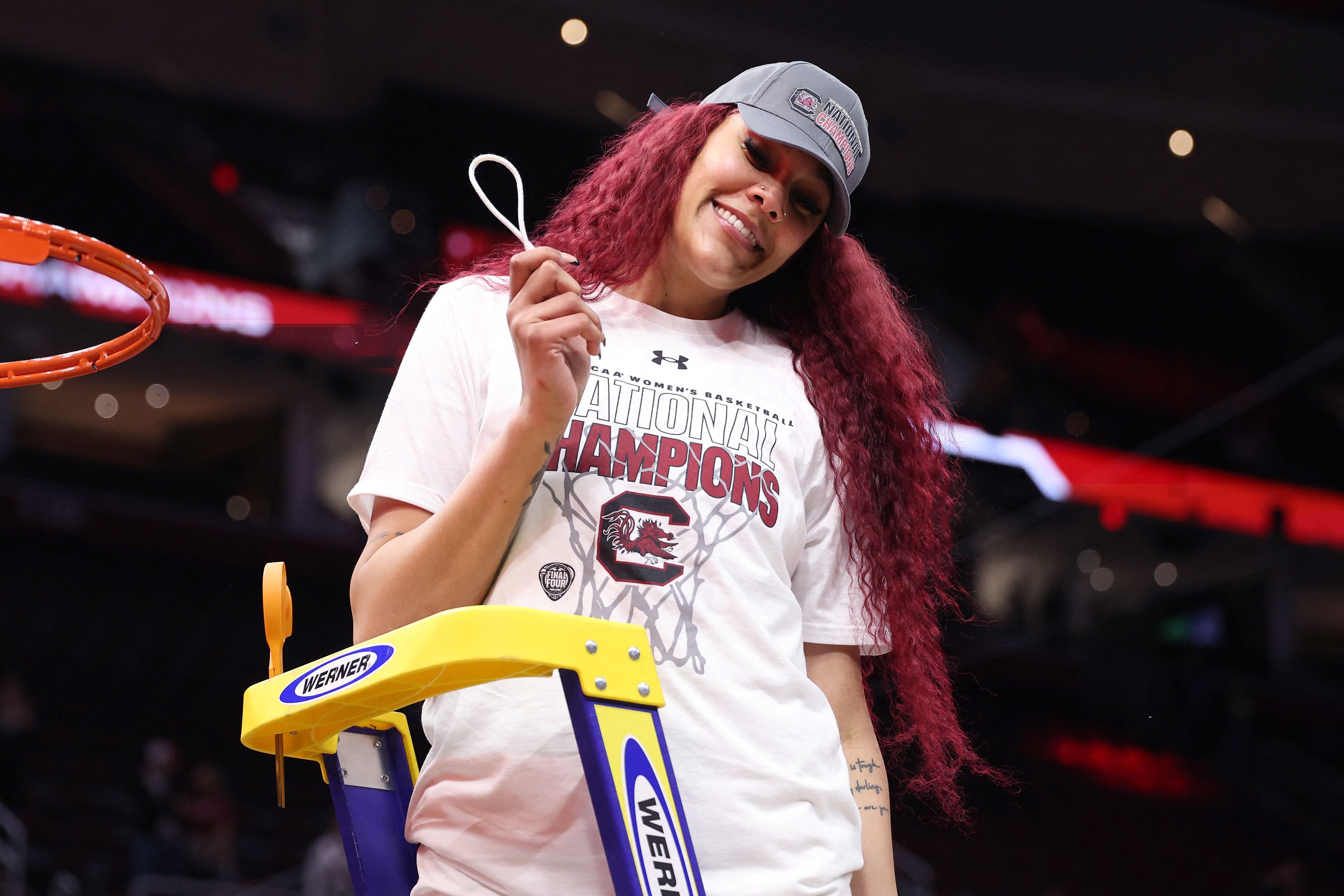 CLEVELAND, OHIO - APRIL 07: Kamilla Cardoso #10 of the South Carolina Gamecocks cuts down the net after beating Iowa Hawkeyes in the 2024 NCAA Women's Basketball Tournament National Championship at Rocket Mortgage FieldHouse on April 07, 2024 in Cleveland, Ohio. South Carolina beat Iowa 87-75.   Gregory Shamus/Getty Images/AFP (Photo by Gregory Shamus / GETTY IMAGES NORTH AMERICA / Getty Images via AFP)