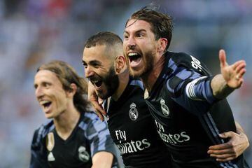 Modric, Benzema and Ramos celebrate Real Madrid's second goal.