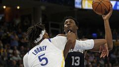May 3, 2022; Memphis, Tennessee, USA; Memphis Grizzlies forward Jaren Jackson Jr. (13) shoots as Golden State Warriors forward Kevon Looney (5) defends during the first half during game two of the second round for the 2022 NBA playoffs at FedExForum. Mand