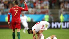 SARANSK, RUSSIA - JUNE 25:  Cristiano Ronaldo of Portugal reacts while Morteza Pouraliganji of Iran lies on the pitch during the 2018 FIFA World Cup Russia group B match between Iran and Portugal at Mordovia Arena on June 25, 2018 in Saransk, Russia.  (Photo by Clive Brunskill/Getty Images)