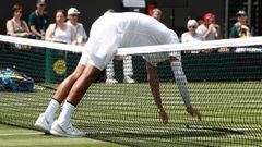 Australia&#039;s Nick Kyrgios bends over the net during his men&#039;s singles first round match against Australia&#039;s Jordan Thompson on the second day of the 2019 Wimbledon Championships at The All England Lawn Tennis Club in Wimbledon, southwest London, on July 2, 2019. (Photo by Adrian DENNIS / AFP) / RESTRICTED TO EDITORIAL USE