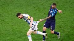 Soccer Football - FIFA World Cup Qatar 2022 - Semi Final - Argentina v Croatia - Lusail Stadium, Lusail, Qatar - December 13, 2022 Argentina's Lionel Messi in action with Croatia's Marcelo Brozovic REUTERS/Hannah Mckay     TPX IMAGES OF THE DAY