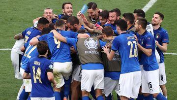 Italy players celebrate after beating Wales in the group stage. 